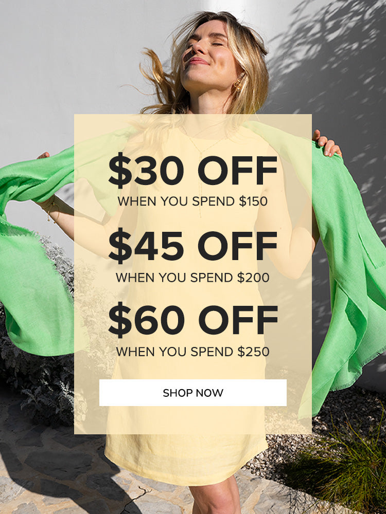 Woman holding a green scarf with promotional text overlay on a natural background